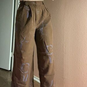 Paloma Wool Brown Pants with lavender kissing faces Pattern